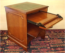 Yew Desk with Green Leather Gold tooled Top, Mouldings on sides, sliding keyboard tray and middle shelf